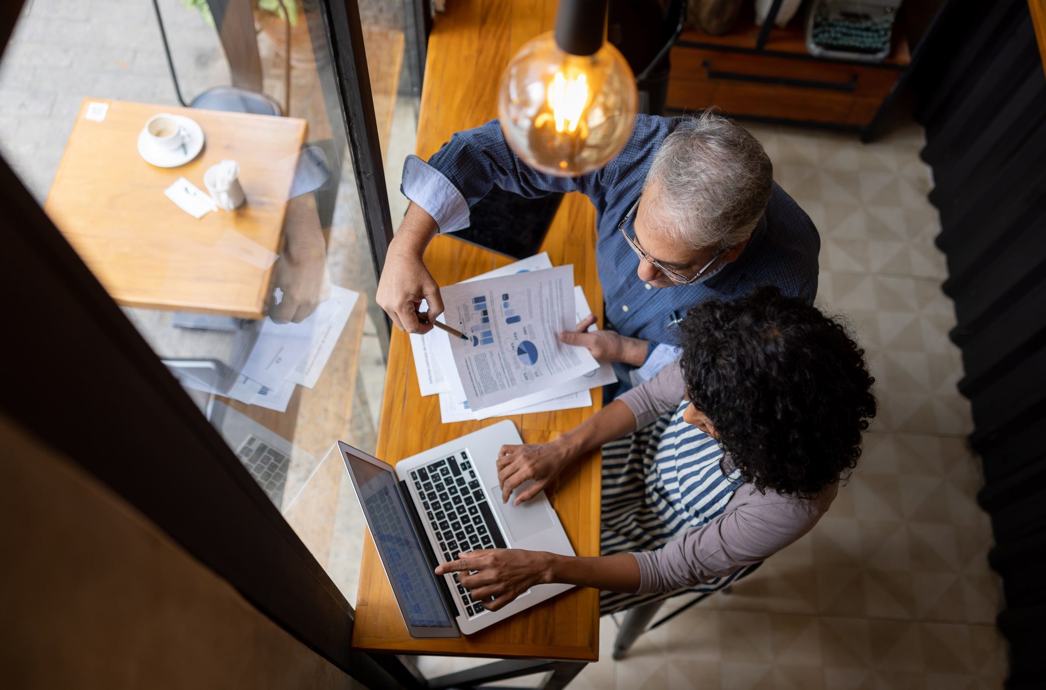 top down view of business owner and accountant managing finance